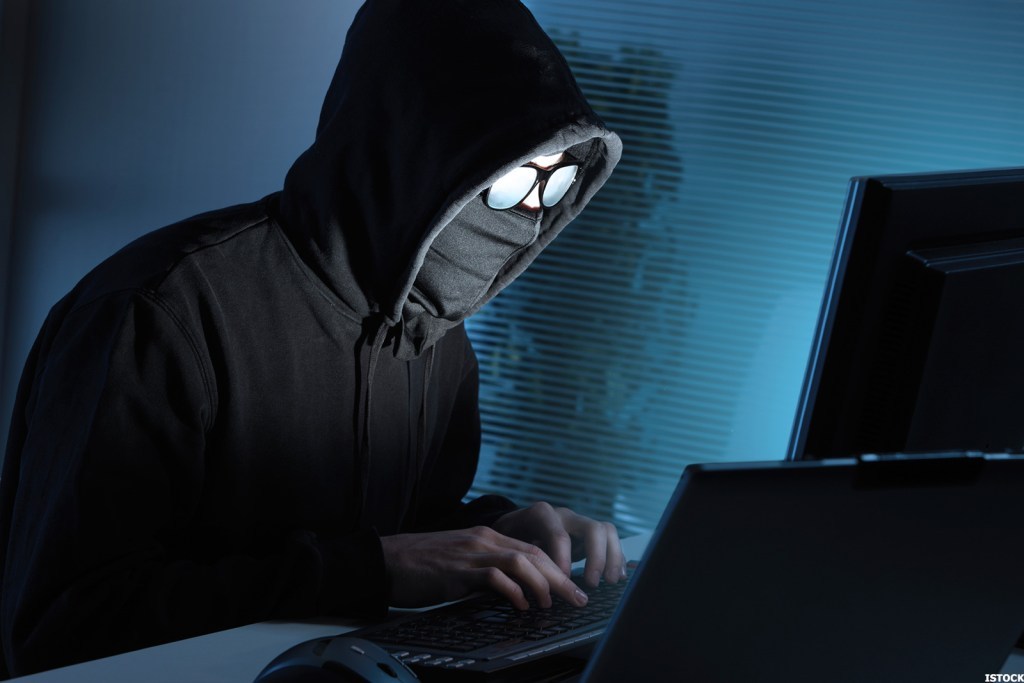 Hacker stealing data from computer